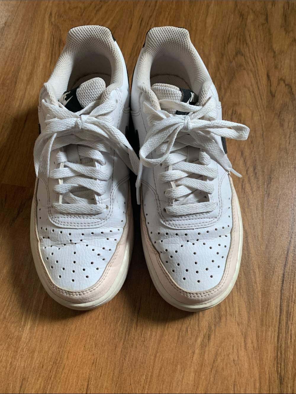 Nike White Leather Low-Top Sneakers with Black Swoosh